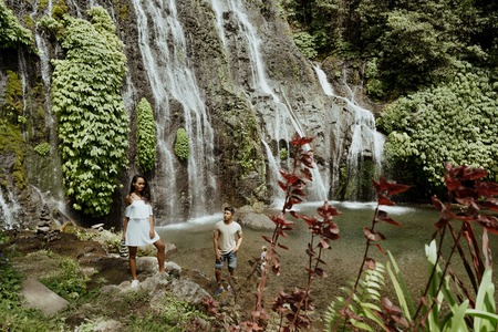 couple fun with their trip together in tropical islandの写真素材