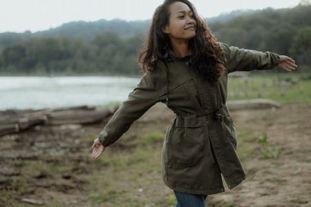 woman enjoy herself in beautiful landscapeの写真素材