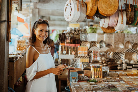 asian woman with tanned skin in the souvenir shop