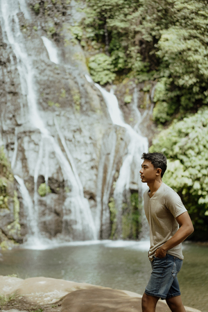 man enjoy his summer vacation in tropical islandの写真素材