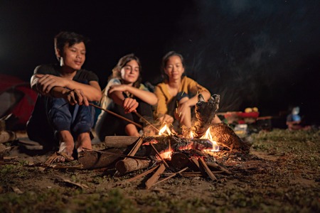 A group of friends having fun campingの写真素材