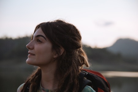 Portrait caucasian woman looking around the riverの写真素材