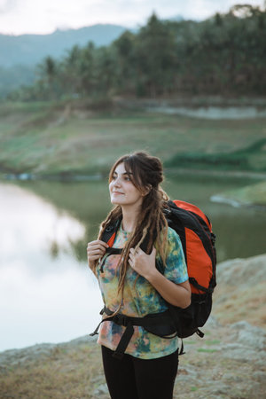 Portrait caucasian woman hiker alone enjoy the beauty of nature