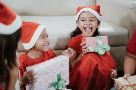 happy daughter laughing after getting presentの写真素材