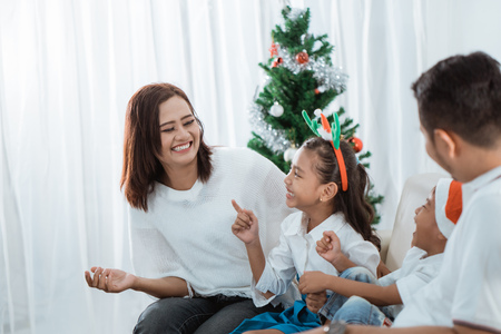 asian family enjoying christmas day togetherの写真素材