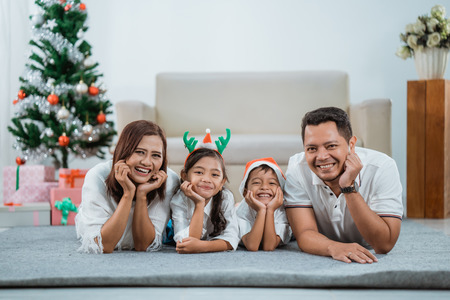 happy family together enjoying their christmas dayの写真素材