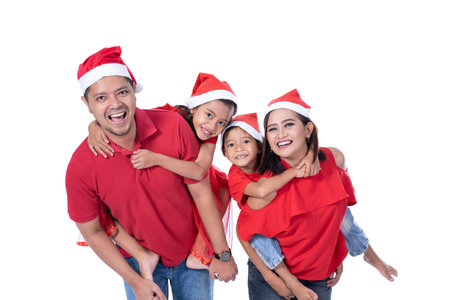 happy asian family wearing red christmas