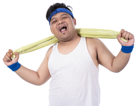Portrait of fat young men laugh after exercising with towelの写真素材
