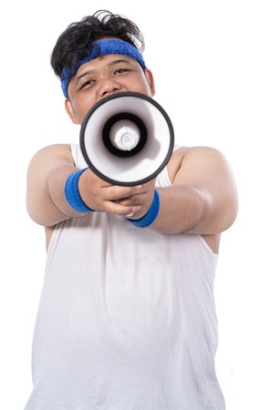 portrait of sporty young man with megaphoneの写真素材