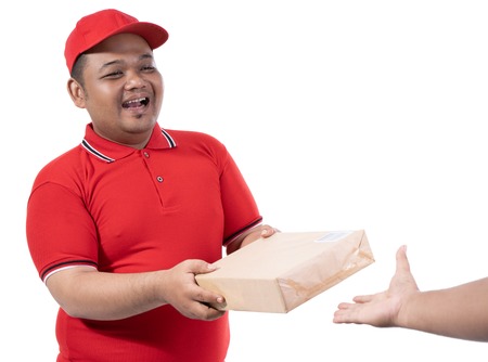 portrait of delivery man hold boxes and a customer handの写真素材