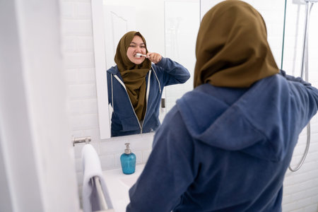 young woman hijab doing routine activities