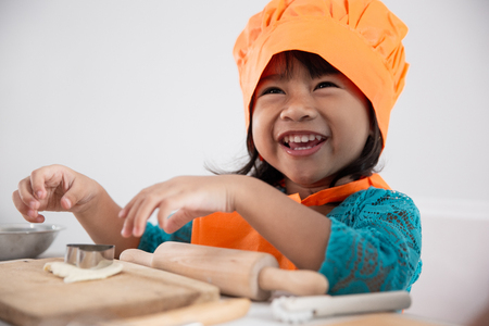 happy asian toddler make a doughの写真素材