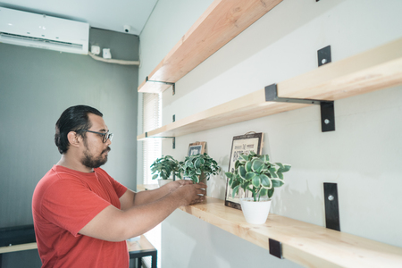 portrait of asian man organized the shelfの写真素材
