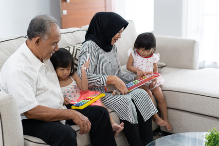grandparent with their granddaughters playing togetherの写真素材