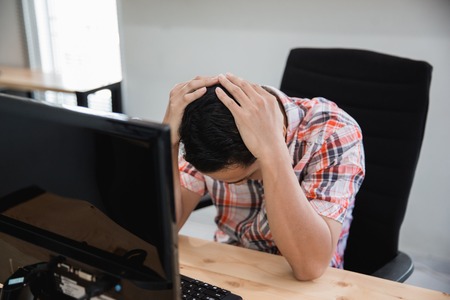 business crisis. asian man on his great depressionの写真素材
