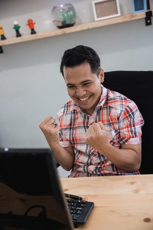 man excited to win jackpotの写真素材
