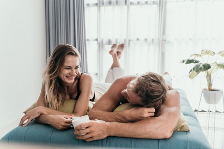Beautiful young romantic couple bondingの写真素材