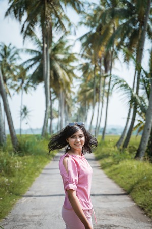 asian woman summer day in tropical islandの写真素材
