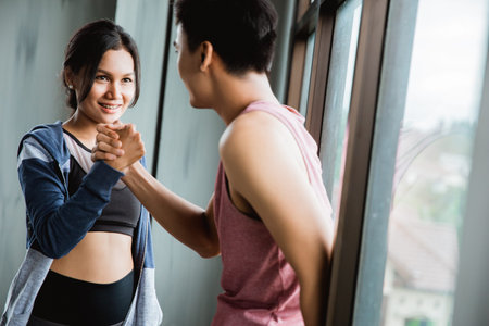 gesture of sport shake hand in the gym
