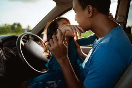 father daughter playing in the car togetherの写真素材