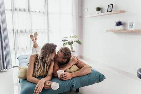 Beautiful young romantic couple bondingの写真素材