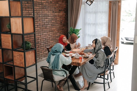 muslim asian woman having lunch togetherの写真素材