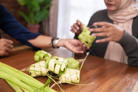 making ketupat traditional indonesian rice cake