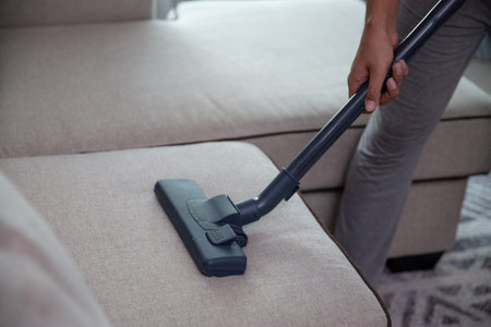 hand using vacuum cleanerの写真素材