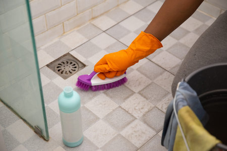 hand brushing toilet bathroom floor