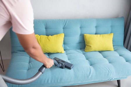 man using vacuum cleanerの写真素材