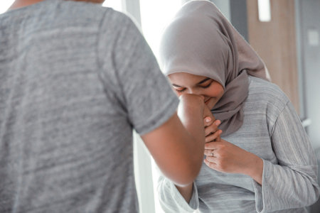 woman shake hand and kiss her husbands hand