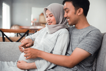 couple looking at ultrasound imagesの写真素材