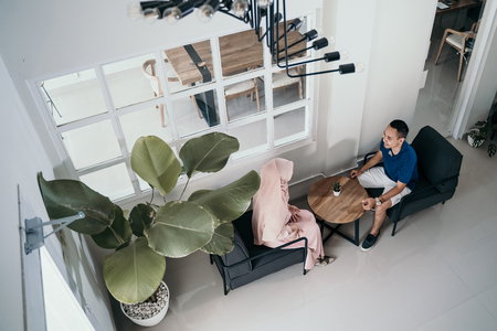 couple in cafe talking. muslim asian peopleの写真素材