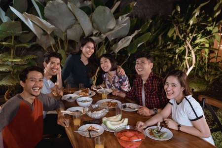 asian people dinner garden party at home with friendの写真素材