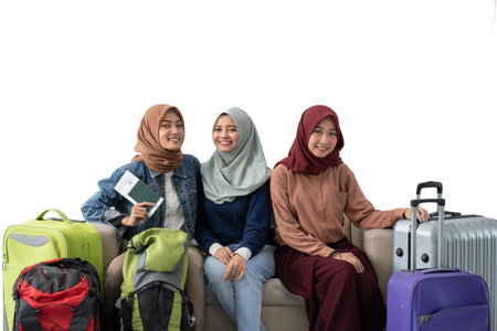 muslim woman traveler sitting with suitcase