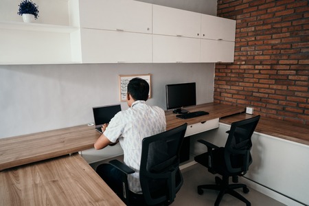 man works with a laptopの写真素材