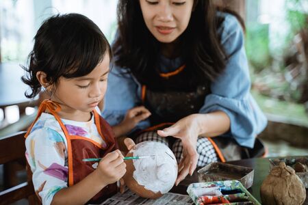 daughter learning about painting colorの写真素材