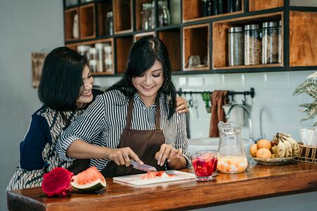 woman make sweet drink from fruitsの写真素材