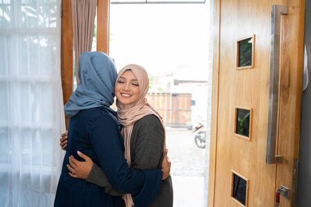 daughter and mother greet each other apologizingの写真素材