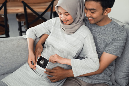 couple looking at ultrasound images