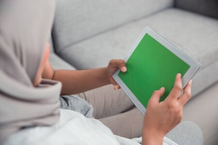 couple looking at tab screen imagesの写真素材