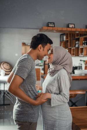 romantic husband and wife muslim holding handsの写真素材