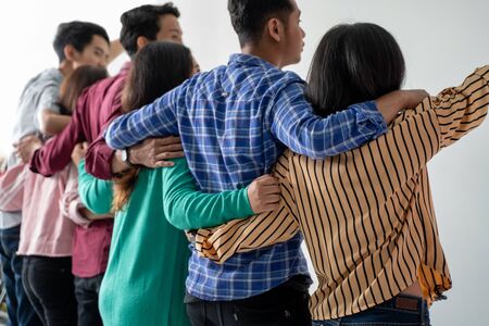 best friend holding hand shoot from behindの写真素材