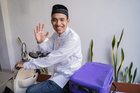 muslim male travelling for eid mubarak  by motorcycle