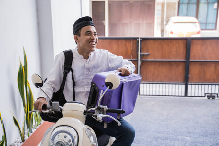 muslim male travelling for eid mubarak  by motorcycle