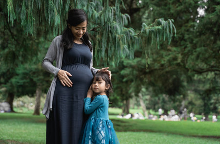 pregnant woman with her daughter