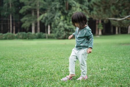 little daughter having fun aloneの写真素材