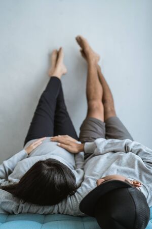 portrait of husband and wife who are relaxing on the couchの写真素材