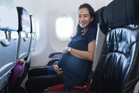 pregnant mother happy enjoy flight securityの写真素材
