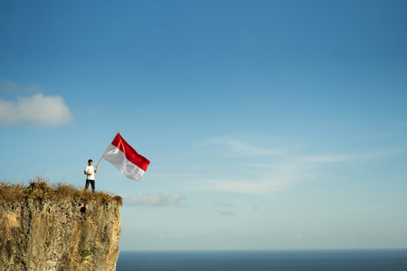 asian male with indonesian flag celebrating independence day